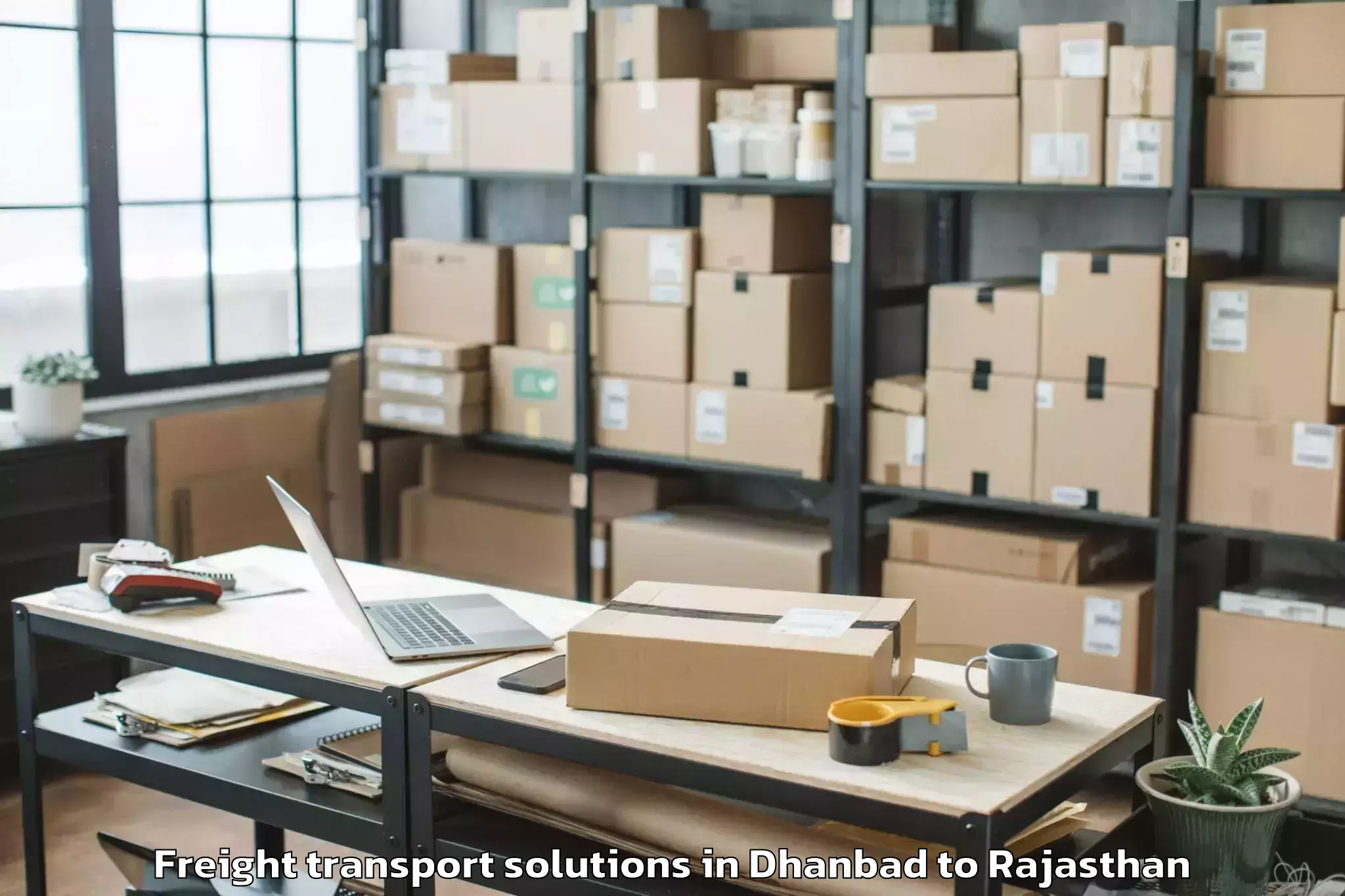 Top Dhanbad to Rajakhera Freight Transport Solutions Available